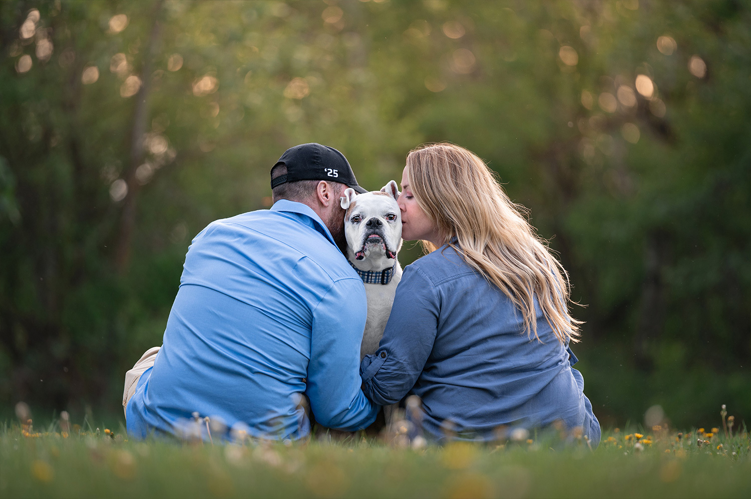Button owners kissing dogs head